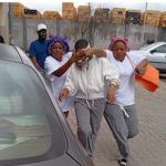 Comfort (middle) was released from the correctional centre on Wednesday.