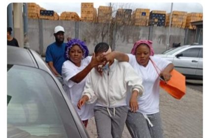 Comfort (middle) was released from the correctional centre on Wednesday.